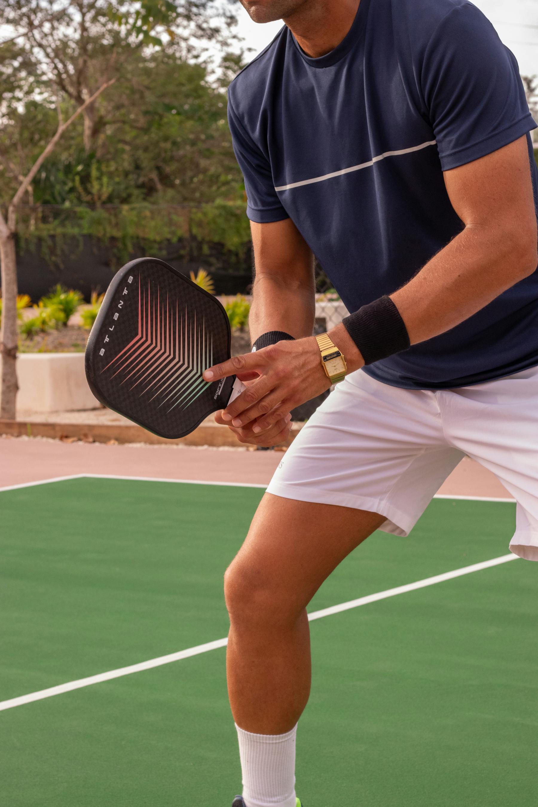 Player preparing to serve on a freshly-finished court